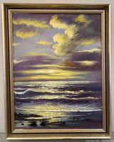 Front view of framed seascape oil painting, signature visible