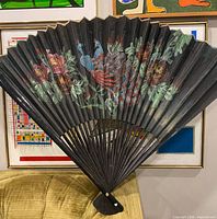 Fan fully opened showing size and painted design