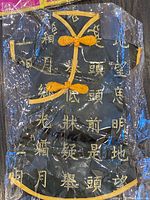 Black satin Chinese robe outfit sealed in plastic