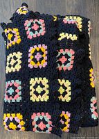 Folded crochet blanket showing overall pattern