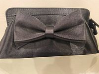 Front view showing satin fabric and bow