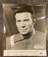 Front view of signed photograph showing Shatner portrait and signature