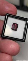 Emerald-cut Rubelite Tourmaline in display case