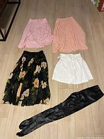 Five skirts laid out showing colors and styles