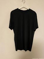 Black Arc’teryx T-shirt hanging front view