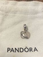 Front view of Pandora charm on cloth pouch