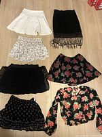 All seven garments laid out on floor