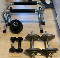 Overall view of push-up bars, dumbbells and plates