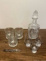 Decanter with stopper, four tumblers, three tasting glasses, ice tongs
