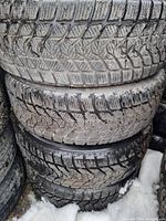 Stack of winter tires showing tread pattern