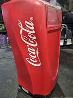 Side view showing Coca-Cola logo and overall form