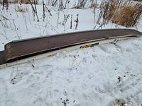 Full view of one ramp in snow, showing length and side rails