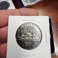 Reverse with Voyageur canoe design and 1972 date