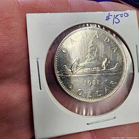 Voyageur reverse of 1981 Canada dollar in flip with $15 notation