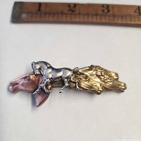 Front view showing full 3-metal horse design with ruler for scale