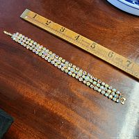 Full view of bracelet next to ruler showing length
