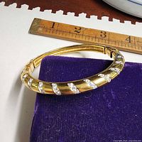 Top view of bracelet beside ruler showing size and crystal detailing