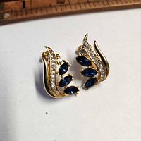 Front view of both earrings showing blue marquise stones and clear rhinestone row