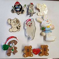 All eight holiday brooch pins laid out on white background