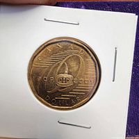 Reverse of 2009 Montreal Canadiens commemorative loonie in cardboard holder