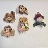 Front view of all five brooches