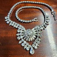 Full view of rhinestone necklace on wood surface