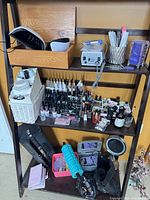 Full view of three-tier shelf with esthetician supplies