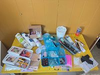 Overview of entire lot on yellow table