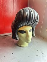 Front view of foam head showing eyes and hair