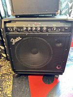 Full front view of Fender Baseman 100 amplifier on casters