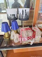 Entire lot showing all lamps, shades and glass blocks