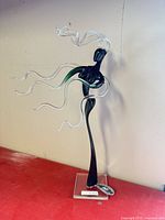 Full view of glass figurine on base