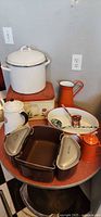 group shot of all enamelware items on table