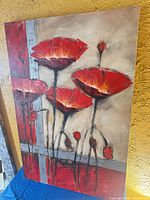 Full view of red flower painting on canvas