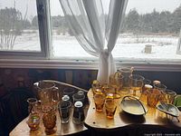 Overview of amber glassware and decor on tables