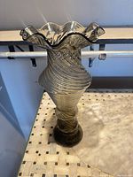 Full view of spiral glass vase showing overall shape and height