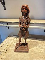 Front view of full statue on base