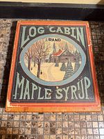 Top view showing Log Cabin Brand Maple Syrup graphic lid