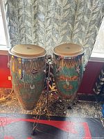 Both congas on stand showing overall condition and finish