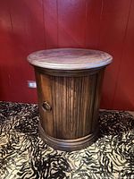 Full view of drum side table showing door and hardware