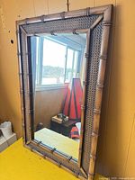 Front view of rectangular mirror showing full frame and glass