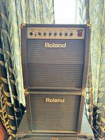Full view of stacked Roland 405 amplifier and speaker cabinet