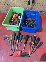 overview of screwdrivers, folding hex key set, loose hex keys, and two bins