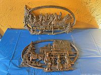 Both Syroco plaques side by side on table