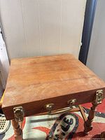 Top view of teak cutlery case showing flat surface and hardware