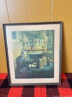 Framed colour photograph showing full image and frame