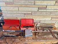 overall lot on bench: toolboxes, saws, soldering irons, grey case