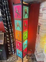Full view of square Elvis Presley fabric-panel floor lamp standing in corner