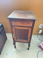 Full view of smoker’s stand showing drawer, door, and legs