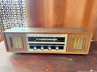 Front view of radio showing faceplate, knobs and speakers